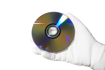 Hand in a white glove holding the compact disc CD. Isolated on white background