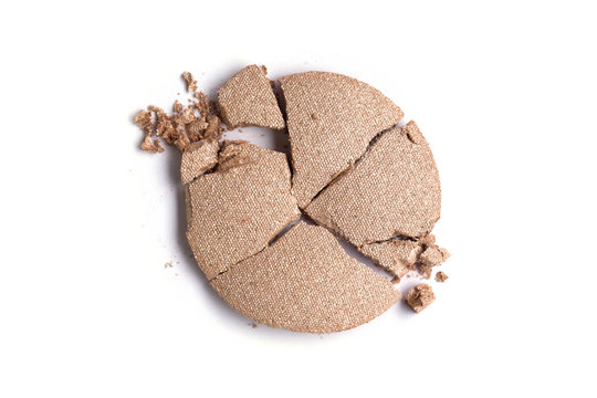 Round pink crashed eyeshadow product isolated on white background