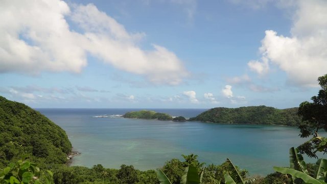 Seascape tropical island, lagoon, beach and hills.. Tropical landscape sky, clouds and mountains rocks with rainforest. Blue lagoon in the ocean. 4K video. Travel concept.