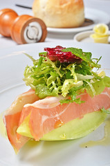 Close up of fresh melon with ham  salad