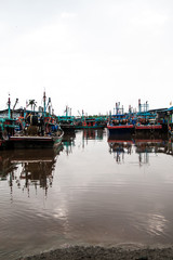 Fisherman boats at the Fisherman village bay. Subject Contain Over expose on the top background.