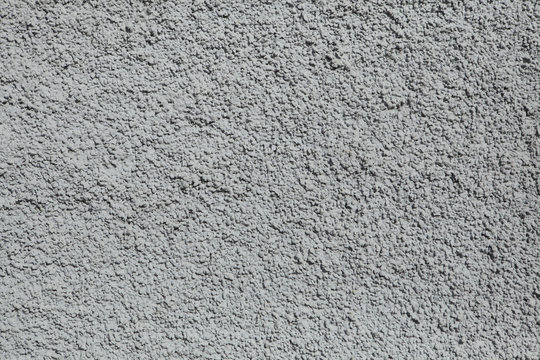 Grey painted stucco wall. Background texture