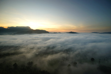 sunrise over the hills with sea fog