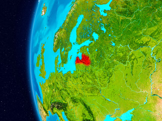 Space view of Latvia in red