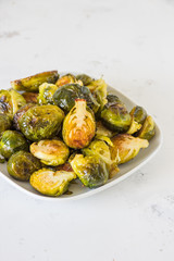 Cooked Brussels sprouts in a white plate
