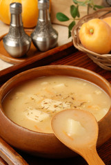 Potato soup in a wooden bowl 