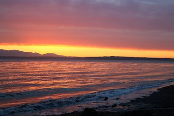 colorful waterfront sunset glows