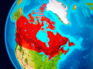 Space view of Canada in red