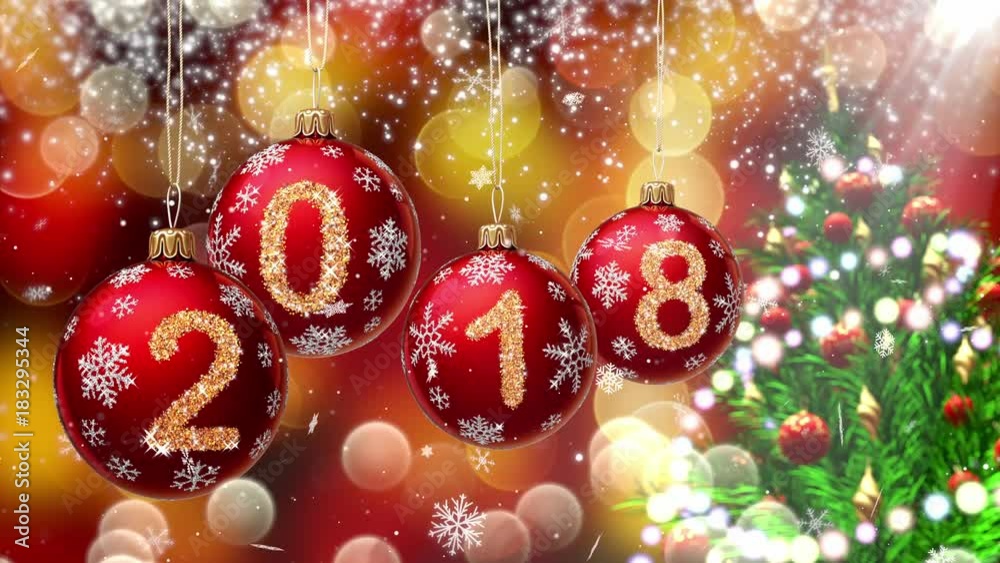 Sticker red balls with numbers 2018 hanging on the background of a bokeh and a rotating christmas tree. 3d r