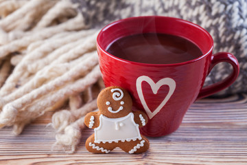 hot chocolate with gingerbread man and cozy blanket