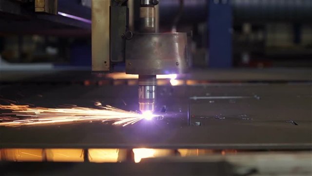Medium close plasma cuter cutting holes in steel