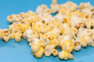 popcorn in wooden on blue background