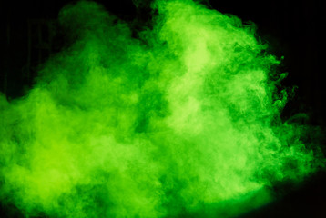 Green theatrical smoke on stage during a performance or show.