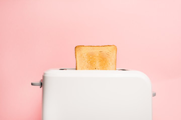 Healthy fashion food of breakfast. Toast in a toaster on a pink background. - obrazy, fototapety, plakaty