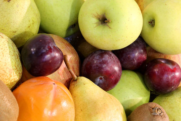 background of many fruits such ad green apples pears plum and ri