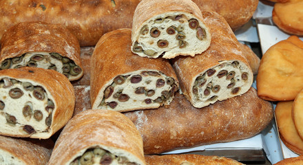 loaf of bread stuffed with green olives for sale in the Mediterr