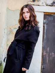 A mysterious girl in a black coat