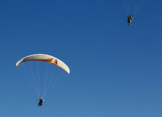 Two people paragliding in the belgian sky