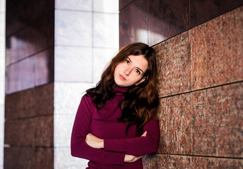 Brunette woman with long hair posing on the street city
