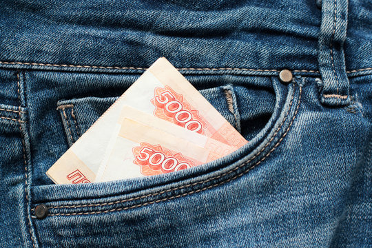 Russian money roubles in blue jeans pocket as a top view image