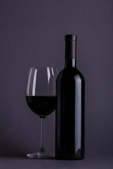 Red wine glass and bottle