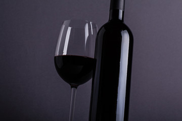 Red wine glass and bottle