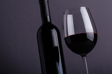 Red wine glass and bottle