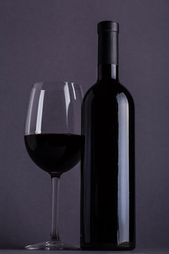 Red wine glass and bottle