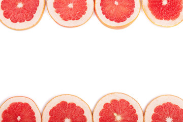 Grapefruit slices isolated on white background with copy space for your text. Top view. Flat lay pattern