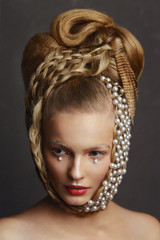 Beauty portrait of young woman with creative fashion hairstyle.