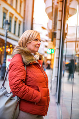 Nice woman at the window of a shop