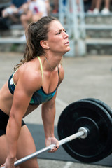 Fototapeta na wymiar Woman lifting weights