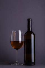 White wine glass and bottle