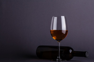 White wine glass and bottle