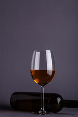 White wine glass and bottle