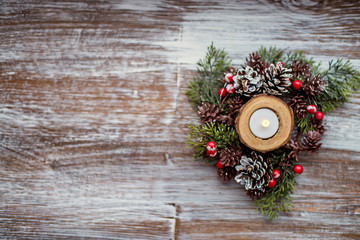 Christmas card. Christmas candle and rustic decoration on vintage wood background. Copy space, flat lay, top view. vintage color style.