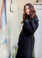 A mysterious girl in a black coat