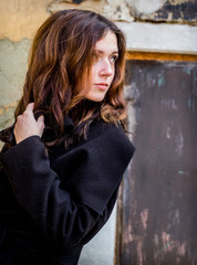 Obraz premium A mysterious girl in a black coat