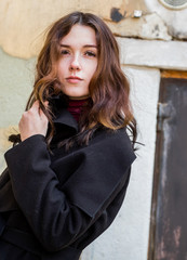 A mysterious girl in a black coat