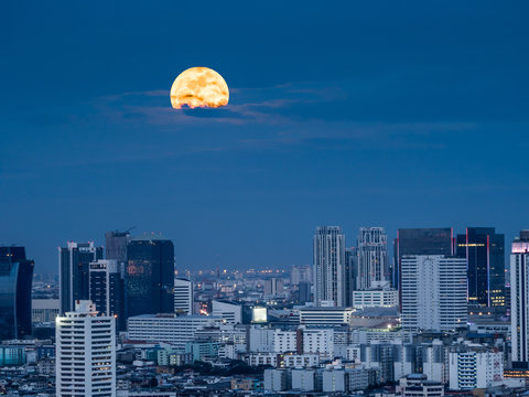 The shiny moonlight from the giant moon of supermoon phenomenon in capital city of Thailand, Bangkok
