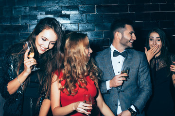 Group of friends enjoying party, having fun and dancing