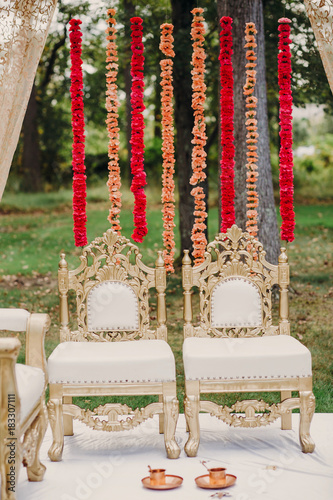 Bronze Cups With Spoons Stand On The Floor Before Golden