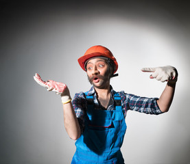 Unusual, cheerful builder. On your hand, paste the advertised item.