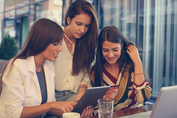 Young girls at cafe. Close up.