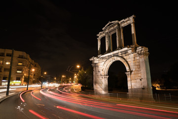 Fototapeta na wymiar Night view Arch of Hadrian that leads to the pillars of Zeus's archaeological site.