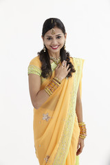 Indian woman in traditional clothing greeting