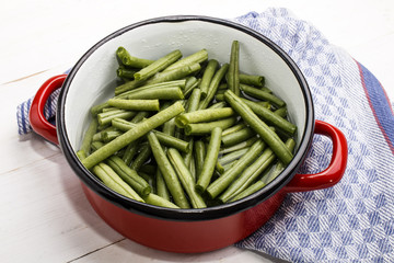 green beans in a water filled enamel pot