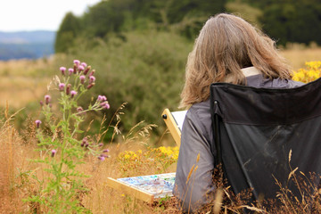 Woman Painting Outdoors