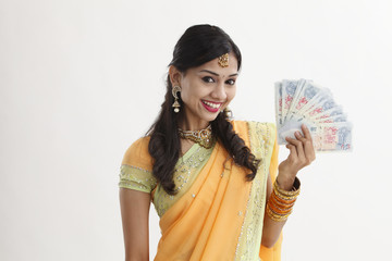 indian woman holing cash