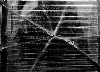 Big crack on the glass wall black and white texture, background